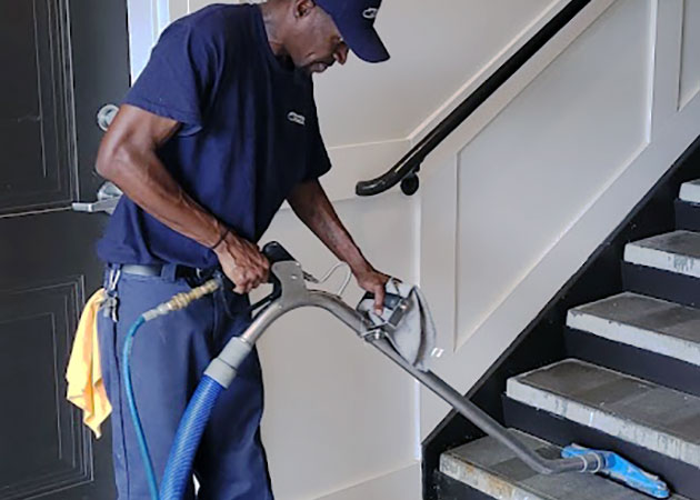 A man cleaning concrete stairs